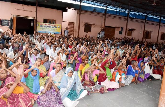 Ashram residents greeting volunteers
